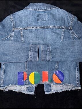 Ralph Lauren Polo Light Blue Denim distressed Jacket. Polo print on the back.